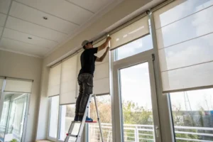 a worker in installing roller shades